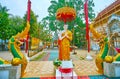 The sculpture of Bhikkhu Monk and Naga serpents at Wat Phra Singh, Chiang Rai, Thailand Royalty Free Stock Photo