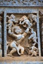 Sculpture of Bhima tossing the elephants like a toy. Chennakeshava temple. Belur, Karnataka. An episode from Mahabharata. Royalty Free Stock Photo