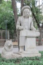 Sculpture of blacksmith with hammer and anvil and wolf dog lying next to him in Karaalioglu park Antalya Turkey