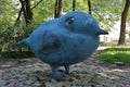 Sculpture of a blue bird in the park