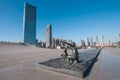 Sculpture of boy and girl in front of Xinghai Square