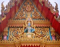 Sculpture of a buddhist deity at Wat Chaithararam temple complex in Phuket, Thailand