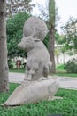 Sculpture bull buffalo sit on fur seal fish with planet around its neck in Karaalioglu park Antalya Turkey