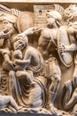 Sculpture carved on marble showing roman soldier attacking a woman with her child Royalty Free Stock Photo