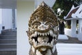 Sculpture carving ancient stone lion singha guardian figure of Wat Traphang Thong temple for thai people and foreign travelers Royalty Free Stock Photo