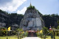 Sculpture carving big buddha carving on stone cliff mountain Wat Khao Tham Thiam for thai people travelers travel visit respect