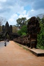 Sculpture carving figure deity angel spirit and Naga statue at entrance ancient ruins building Nokor Thom of South Gate bridge in