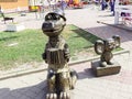 sculpture of Cheburashka and Crocodile Genes illuminated by the sun