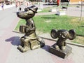 sculpture of Cheburashka and Crocodile Genes illuminated by the sun