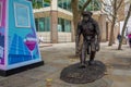 Sculpture of a chimpanzee standing from the Chimps are Family exhibition at London Bridge City, UK