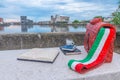 Sculpture of a coffee cup and books on a bench in Ravenna, Italy