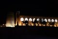 Sculpture composition of Caravan with drover and camels on old town wall of Ichan-Kala. Khiva - ancient city at Silk