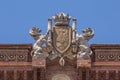 Sculpture and crest atop the Arc de Triomf in Barcelona, Spain