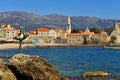 Sculpture of dancing girl and panorama of Budva old town Royalty Free Stock Photo