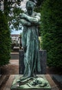 Sculpture of death angel inside the monumental cemetery of milan