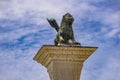 Sculpture depicting image of lion with wings, symbol of Venice, on the top of the column at San Marco, Italy Royalty Free Stock Photo