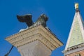 Sculpture depicting image of lion with wings, symbol of Venice, on the top of the column at San Marco, Italy Royalty Free Stock Photo