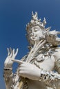 Sculpture detail with white Buddha in all-white buddhist temple Royalty Free Stock Photo