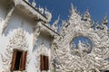 Sculpture detail with white Buddha in all-white buddhist temple Royalty Free Stock Photo