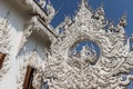 Sculpture detail with white Buddha in all-white buddhist temple Royalty Free Stock Photo