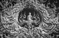 Sculpture detail with white Buddha in all-white buddhist temple Wat Rong Khun in Chiang Rai, Thailand