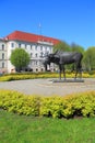 Sculpture `Elk` and the building of civil court of Tilsit in sunny May day in Sovetsk