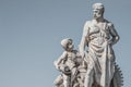 Sculpture of engineer and his scholar on Zoll Bridge in Magdeburg downtown at smooth gradient background, Germany, details,