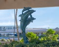 Sculpture featuring a dolphin family on display in a resort on the Big Island, Hawaii.