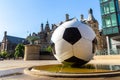 The sculpture of football ball and Sheffield Town Hall, UK