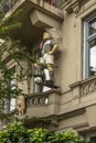 Sculpture of a football player of Fc St Pauli with a scarf on a balcony, Hamburg, Germany