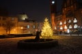 Sculpture Girl with ball in front of the lit Christmas tree in front of the Rathaus KÃÂ¶penick. Berlin, Germany