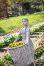 Sculpture of girl with basket in Yildiz Park Royalty Free Stock Photo