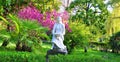 Sculpture `Girl` among southern plants. New Athos, Abkhazia