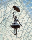 Sculpture of girl with umbrella balances on wire, Bratislava, Slovakia