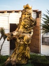 Sculpture of the god of water Neptune from a tree on the sea Russia in Sochi