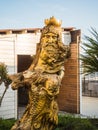 Sculpture of the god of water Neptune from a tree on sea Royalty Free Stock Photo