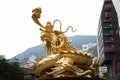 Sculpture golden dragon guardian at roundabout at Morrison Hill road in Hong Kong, China