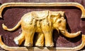Sculpture of golden elephant, element for design and architecture of Thai Buddhist temple Royalty Free Stock Photo