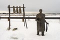 Sculpture of Grandma Olga Nikolai Ezi from Native Village of Eklutna, and a fish rack, located on the Ship Creek small launch. Royalty Free Stock Photo