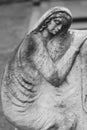Sculpture of grieving woman on a grave. Historic graveyard.