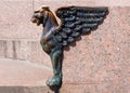 Sculpture of griffin on embankment of the Neva river in the city