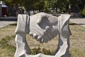 Sculpture handshake. Symbol of friendship and cooperation