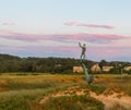 Sculpture of the harpooner during the sunset