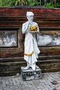 Sculpture of a Hindu Priest holding a cup of Holy Water in Tirta Embul