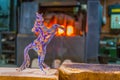 Sculpture of horse made of murano glass cooling in a factory in Murano, Italy....IMAGE