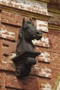Sculpture of a horse`s head on the brick wall Pskov oblast, Russia