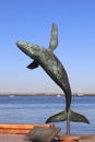 Sculpture of a humpback whale jumping.