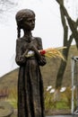 Sculpture of hungry young girl with ears of wheat in her hands. Kiev, Ukraine Royalty Free Stock Photo