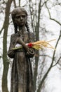 Sculpture of hungry young girl with ears of wheat in their hands. Kiev, Ukraine Royalty Free Stock Photo