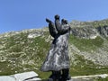 The sculpture il ``viandante`` the Wanderer, sculpture by Pedro Pedrazzini on the Gotthard pass Gotthardpass in the Swiss Alps